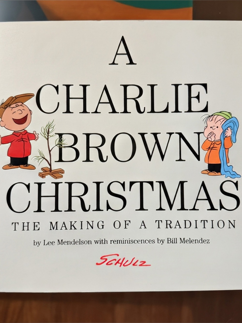 Schulz White Charlie Brown Christmas Book Cover with Colorful Characters